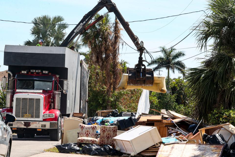 Hurricane debris was being picked up on Capri Blvd. and Grenada Ave. in the Isles of Capri neighborhood, Monday Morning, October 10, 2022.