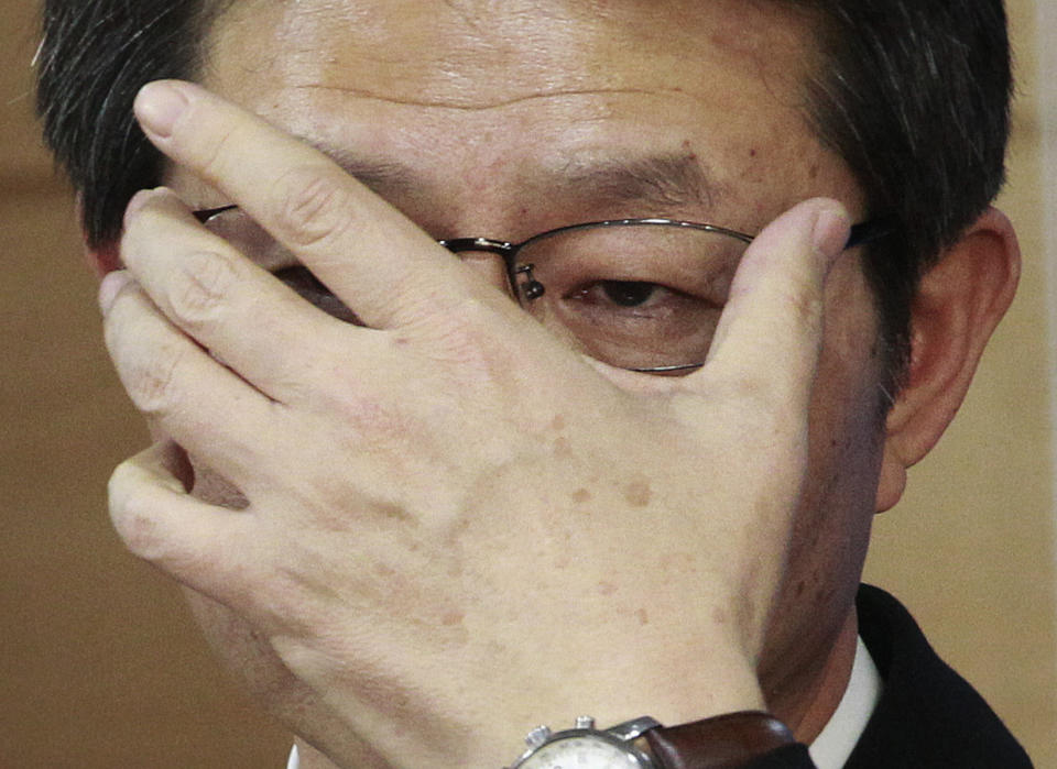 South Korean Unification Minister Ryoo Kihl-jae adjusts his glasses during a press conference at the government complex in Seoul, South Korea, Thursday, Feb. 6, 2014. While North Korea is threatening to cancel a reunion of Korean War-divided families later this month only one day after agreeing on dates for the emotional meetings, Ryoo said that the agreement must be followed. (AP Photo/Ahn Young-joon)