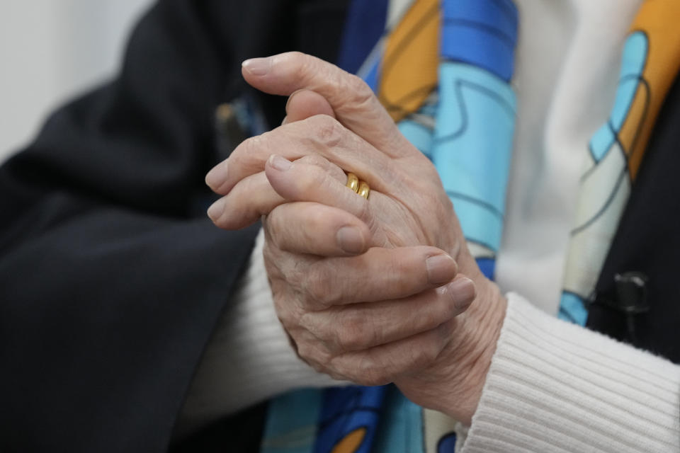 Lee Yong-soo, a South Korean sexual slavery survivor who has been demanding since the early 1990s that the Japanese government fully accept culpability and offer an unequivocal apology, puts her hands together while speaking during an interview in Seoul, South Korea, Wednesday, March 16, 2022. (AP Photo/Lee Jin-man)