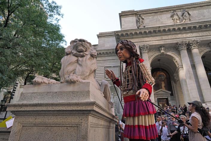 Little Amal, a 3.5-meter-tall puppet of a young Syrian refugee girl is being displayed at New York Public Library on September 15, 2022. Her journey from the Syrian-Turkish border started in July 2021, and she has become a symbol of the struggles of refugees.