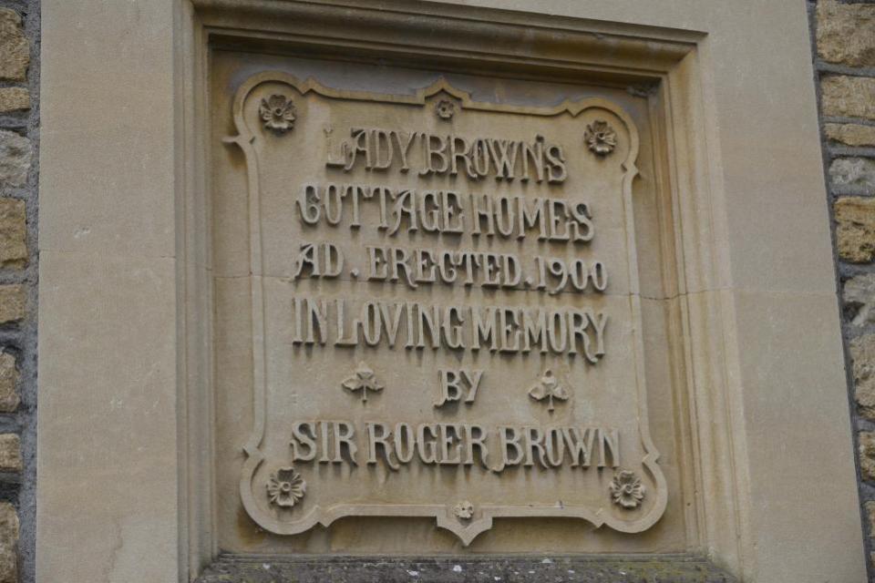 Wiltshire Times: The plaque at Lady Brown’s Cottage Homes in Polebarn Road. Photo: Trevor Porter 68705-2