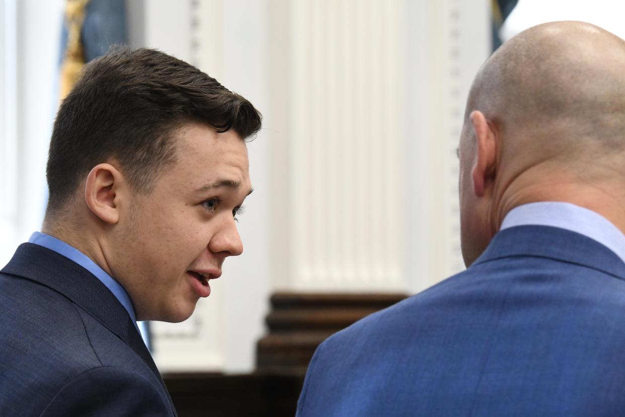 Kyle Rittenhouse talks to defense attorney Corey Chirafisi before closing arguments during his trial at the Kenosha County Courthouse on Nov. 15, 2021, in Kenosha, Wis.