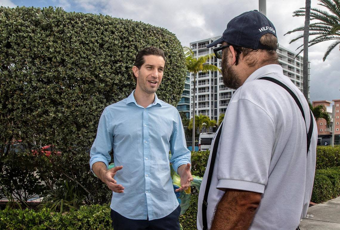 Surfside Mayor Shlomo Danzinger talks to a resident in front of Town Hall on March 23, 2022.