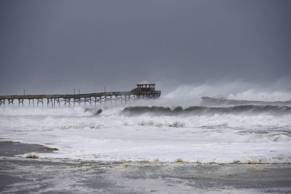 <p>Waves crash around the Oceanana Pier as the outer edges of Hurricane Florence being to affect the coast Sept. 13, 2018 in Atlantic Beach, United States. Coastal cities in North Carolina, South Carolina and Virgnia were under evacuation orders as the Category 2 hurricane approached the United States. (Photo from Chip Somodevilla/Getty Images) </p>