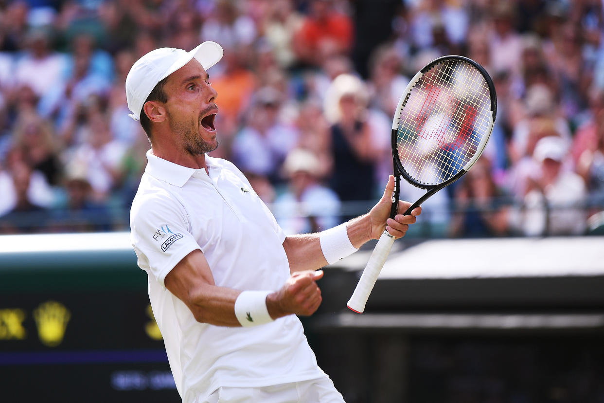 LONDON, ENGLAND - JULY 10: Roberto Bautista Agut of Spain celebrates match point in his Men's Quarter Final match against Guido Pella of Argentina during Day Nine of The Championships - Wimbledon 2019 at All England Lawn Tennis and Croquet Club on July 10, 2019 in London, England. (Photo by Laurence Griffiths/Getty Images)