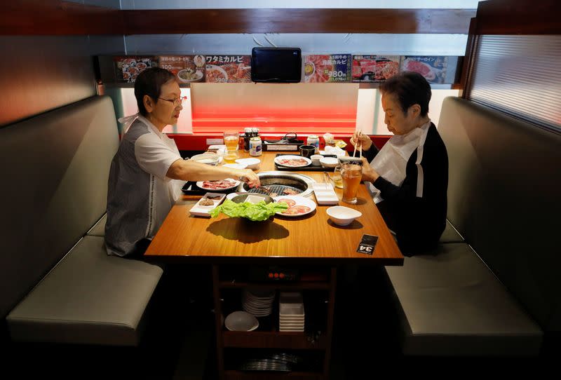 Customers have lunch at the yakiniku barbecue restaurant named 'Yakiniku no Watami', operated by Watami Co., in Tokyo
