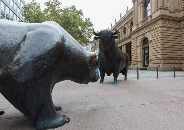 Bear and bull statues stand outside the Frankfurt Stock Exchange. A bull market is a market that is on the rise, while a bear market exists in an economy that is receding. (Martin Leissl/Bloomberg - image credit)