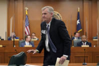 Thad Hill, Calpine President and CEO, departs after he appeared to answer questions a the Committees on State Affairs and Energy Resources holding a joint public hearing to consider the factors that led to statewide electrical blackouts, Thursday, Feb. 25, 2021, in Austin, Texas. The hearings were the first in Texas since a blackout that was one of the worst in U.S. history, leaving more than 4 million customers without power and heat in subfreezing temperatures. (AP Photo/Eric Gay)