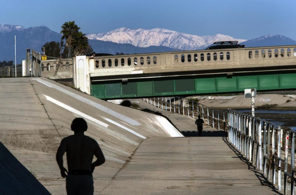 People jog along the Ballona Creek Bike Trail.