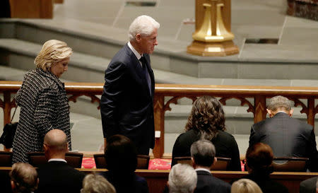 Former first lady Hillary Clinton and former President Bill Clinton arrive at St. Martin's Episcopal Church for a funeral service for former first lady Barbara Bush in Houston, Texas, U.S., April 21, 2018. David J. Phillip/Pool via Reuters