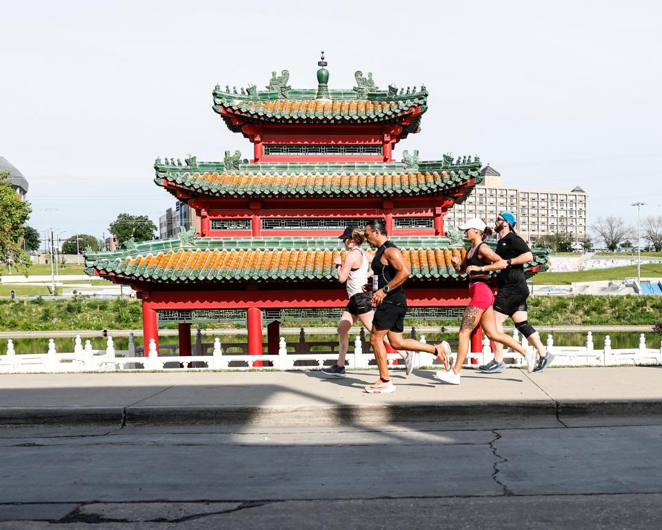 The Robert D. Ray Asian Garden provides a backdrop for runners on the 2022 EMC Dam to DSM half marathon from the Saylorville Dam to downtown Des Moines June 4.