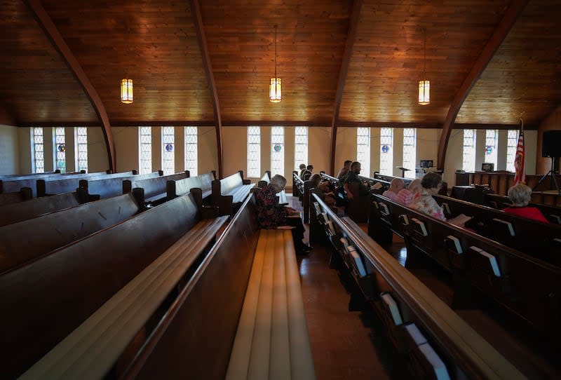 Roughly a dozen people attend pastor Ryan Burge's Sunday service at First Baptist Church in Mt. Vernon, Ill., Sunday, Sept. 10, 2023. Burge is also an associate professor of political science at Eastern Illinois University and author of "The Nones," a book on the growing number of religiously unaffiliated Americans. For him, the rising number of "nones" and the dwindling number of religious is not simply a statistic, but a fact that he's been witnessing in his own parish for the past 16 years. | Jessie Wardarski, Associated Press