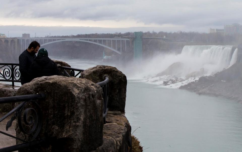 NIAGARA FALLS, March 31, 2021 -- Visitors are seen at the Canadian side of Niagara Falls, Ontario, Canada, on March 31, 2021. Canada's tourism spending was cut 48.1 percent in 2020 and tourism gross domestic product GDP plunged 47.9 percent, Statistics Canada said Wednesday. (Photo by Zou Zheng/Xinhua via Getty) (Xinhua/Zou Zheng via Getty Images)