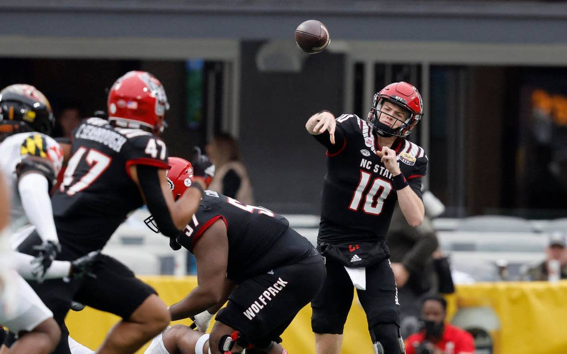 N.C. State quarterback Ben Finley (10) passes to N.C. State tight end Cedd Seabrough (47) during the first half of N.C. State’s game against Maryland in the Duke’s Mayo Bowl at Bank of America Stadium in Charlotte, N.C., Friday, Dec. 30, 2022.