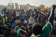 Senegal soccer fans react to their team scoring during World Cup group A soccer match against Ecuador, played in Qatar, on a video screen set up at a fan zone in Dakar, Senegal, Tuesday Nov. 29, 2022. (AP Photo/Leo Correa)