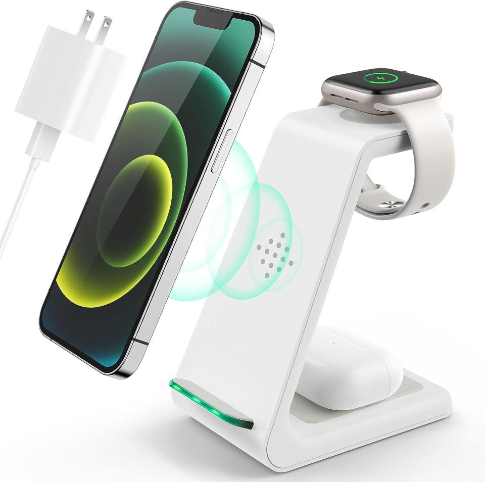 white standing charging station with devices on top