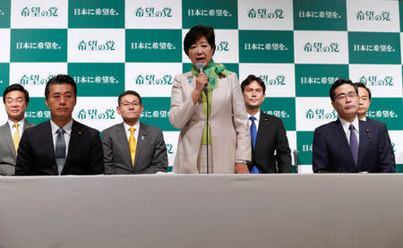 Tokyo Governor Yuriko Koike (C), the leader of her new Party of Hope, attends a news conference to announce the party's campaign platform with her party members, include in Goshi Hosono (2nd L), a former environment minister and Masaru Wakasa (2nd R), a former prosecutor who left the ruling Liberal Democratic Party, in Tokyo, Japan, September 27, 2017. REUTERS/Issei Kato
