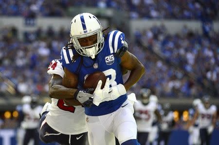 Sep 30, 2018; Indianapolis, IN, USA; Indianapolis Colts wide receiver T.Y. Hilton (13) makes a catch as Houston Texans defensive back Johnathan Joseph (24) defends during the second half at Lucas Oil Stadium. Mandatory Credit: Jeff Curry-USA TODAY Sports