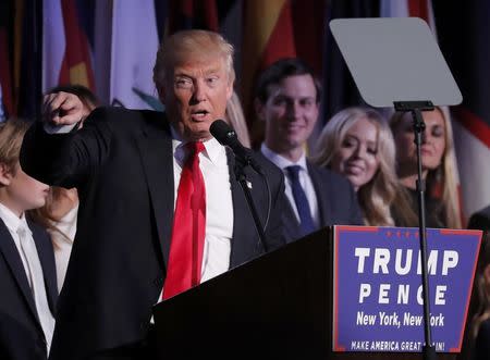 U.S. President-elect Donald Trump addresses supporters as members of his family look on at his election night rally in Manhattan, New York, U.S., November 9, 2016. REUTERS/Andrew Kelly