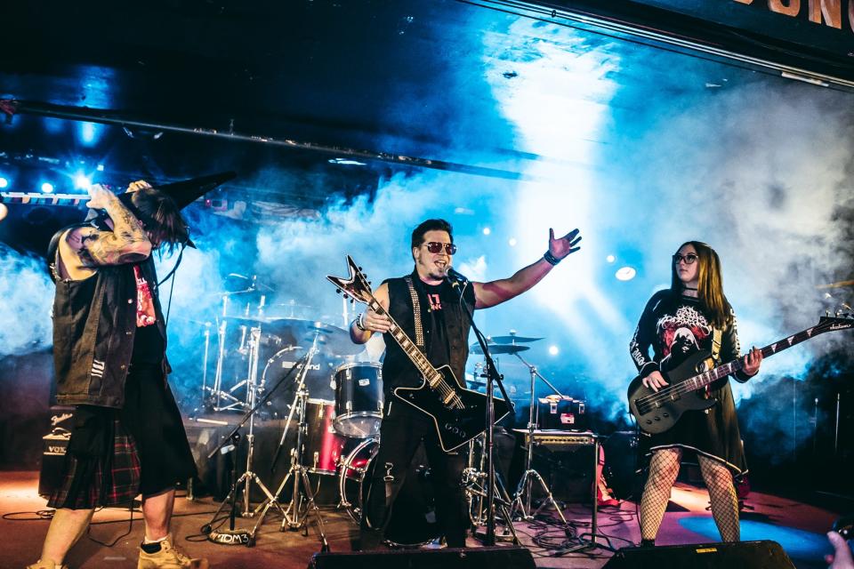 Rockers Joe Blake, left, Timothy Martuch, center, and Katie “Kixx” Puga, right, of Fatal Conceit light up the stage with a live show.