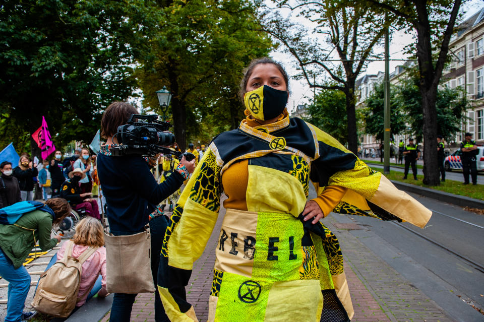 During the new campaign from the climate group Extinction Rebellion in The Netherlands, an 'XR fashion show' was carried out in front of the House of Representatives in The Hague, Netherlands, on September 1, 2020. The models were wearing yellow, black, and white colorful second-hand outfits to symbolize the collectivity of bees, to show that thinking and working together can help us out of this crisis. (Photo by Romy Arroyo Fernandez/NurPhoto via Getty Images)