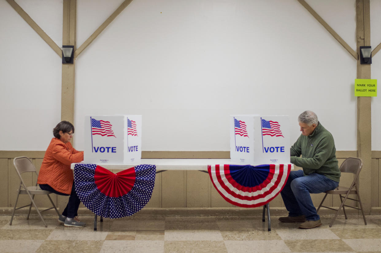 Voters fill out their ballots at the Forest Recreation Center in Bedford County, Va., on Tuesday, Nov. 2, 2021. (Kendall Warner/The News & Advance via AP)