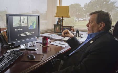 William Merrell, Chairman of the Marine Sciences Department at Texas A&M University, works on the "Ike Dike" project in his university office in Galveston, November 21, 2014. REUTERS/Donna Carson