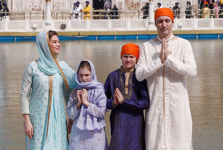 Canadian Prime Minister Justin Trudeau, his wife Sophie Gregoire, daughter Ella Grace and son Xavier pose for photographers during their visit to the holy Sikh shrine of Golden temple in Amritsar, India February 21, 2018. REUTERS/Adnan Abidi