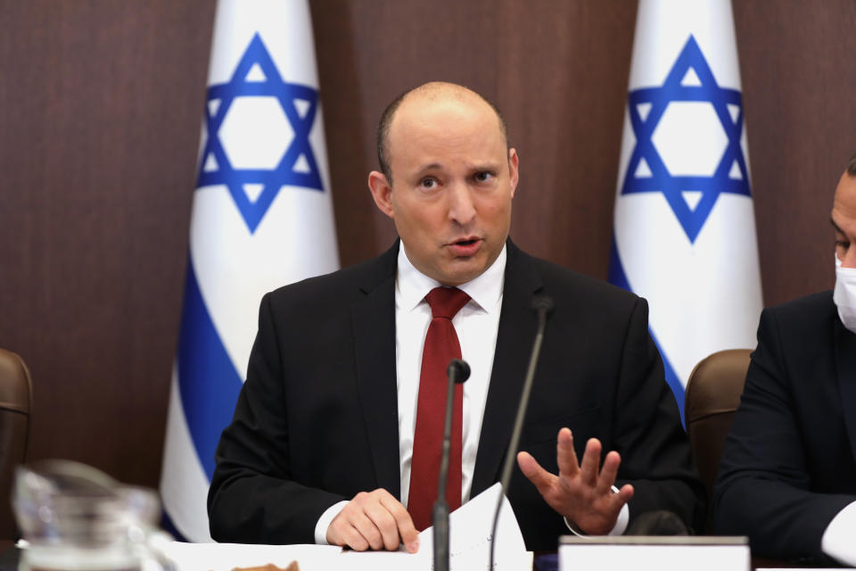 Israeli Prime Minister Naftali Bennett speaks during a cabinet meeting at the prime minister's office in Jerusalem, Israel, Sunday, Dec. 19, 2021. (Abir Sultan/Pool Photo via AP)