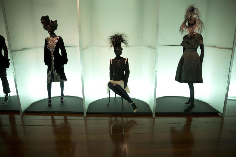 Items by different designers are displayed on mannequins at the press view of the "Isabella Blow: Fashion Galore!" exhibition in London, Tuesday, Nov. 19, 2013. The exhibition, which runs from November 20 to March 2, celebrates the life and wardrobe of the late British patron of fashion and art who discovered many young fashion design talents. (AP Photo/Matt Dunham)