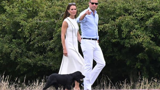 PHOTO: Catherine Duchess of Cambridge and Prince William walk their dog Orla while attending the Royal Charity Polo Cup at Guards Polo Club, Windsor, UK, July 6, 2022. The match is to raise funds and awareness for charities supported by them. (Tim Rooke/Shutterstock)