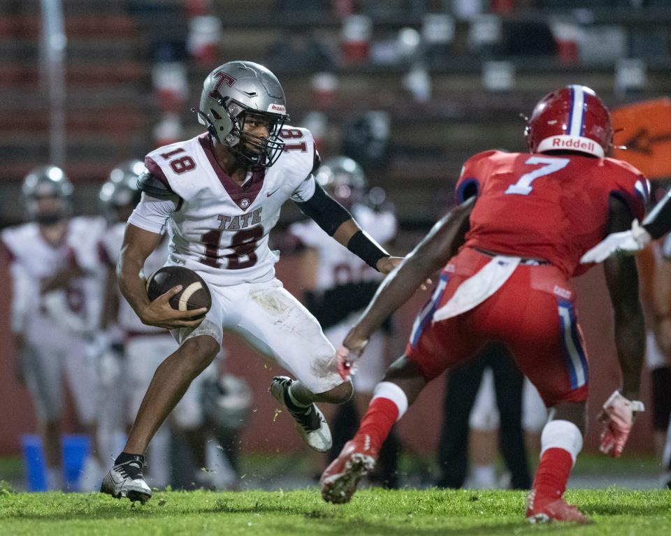 Andre Colston (18) carries the ball during the Tate vs Pine Forest football game at Pine Forest High School in Pensacola on Thursday, Aug. 25, 2022.