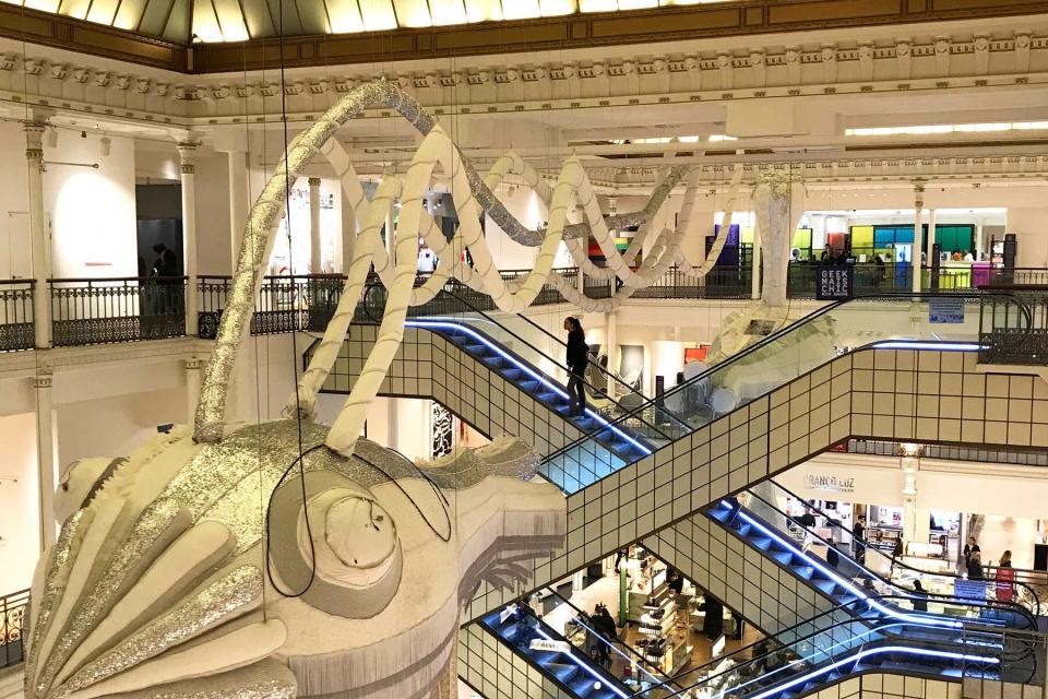 Interior of La Bon Marche in Paris with iconic escalators