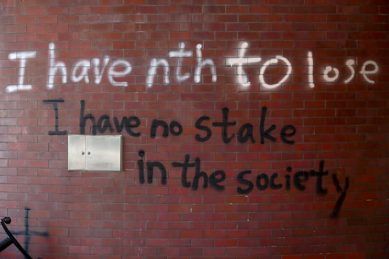 A message is written in graffiti on the campus of the Hong Kong Polytechnic University (PolyU) in Hong Kong