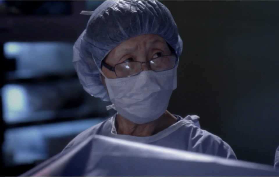 Bokhee in scrubs during surgery on the show