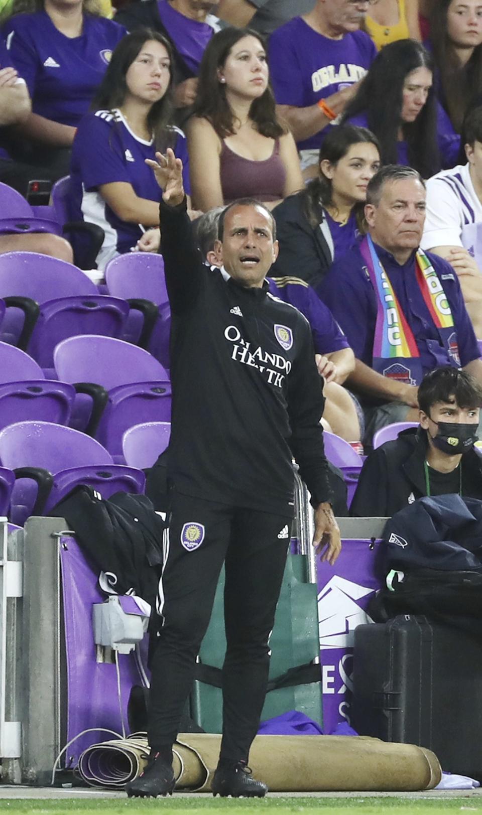 Orlando coach Oscar Pareja coaches during a MSL soccer match in Orlando, Fla., on Tuesday, June 22, 2021. (Stephen M. Dowell /Orlando Sentinel via AP)