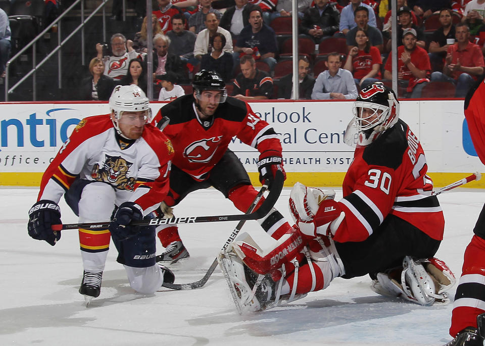 NEWARK, NJ - APRIL 19: Tomas Fleischmann #14 of the Florida Panthers is stopped by Martin Brodeur #30 of the New Jersey Devils as Stephen Gionta #11 skates in to help in Game Four of the Eastern Conference Quarterfinals during the 2012 NHL Stanley Cup Playoffs at Prudential Center on April 19, 2012 in Newark, New Jersey. (Photo by Bruce Bennett/Getty Images)