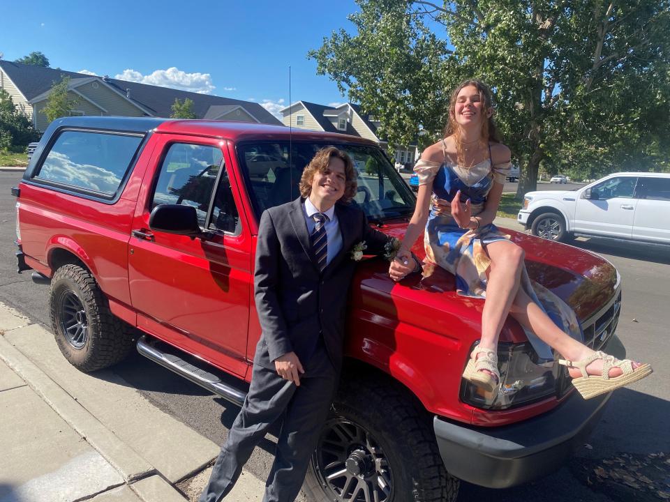 Joseph Tegerdine of Springville, Utah, and his girlfriend, Lily Flake, with his 1995 Ford Bronco before their September 2022 Homecoming.