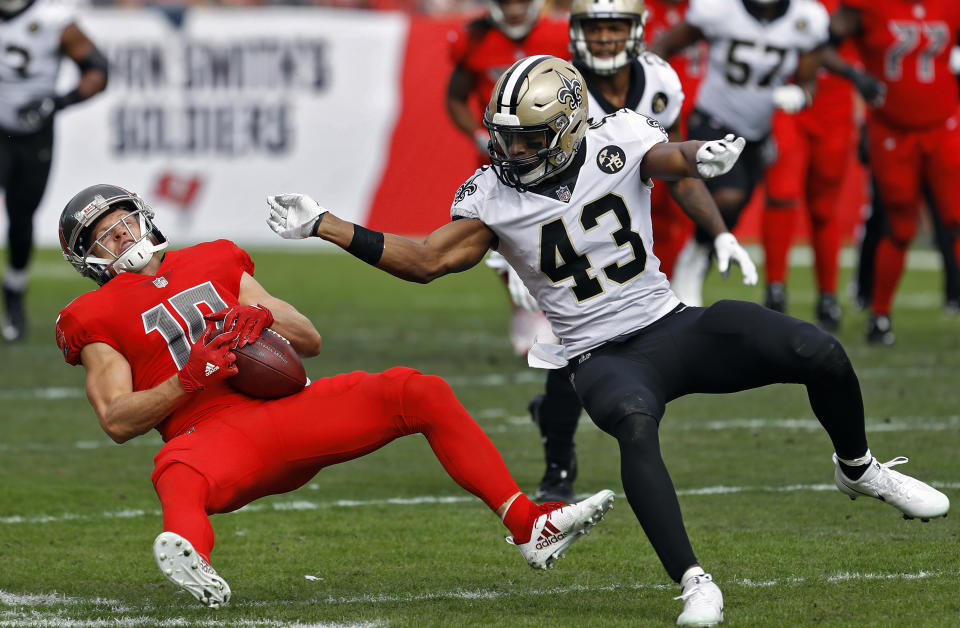 <p>New Orleans Saints free safety Marcus Williams (43) levels Tampa Bay Buccaneers wide receiver Adam Humphries (10) after a reception during the first half of an NFL football game Sunday, Dec. 9, 2018, in Tampa, Fla. (AP Photo/Mark LoMoglio) </p>