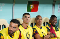 Portugal's Cristiano Ronaldo, middle left, sits on the bench before the World Cup round of 16 soccer match between Portugal and Switzerland, at the Lusail Stadium in Lusail, Qatar, Tuesday, Dec. 6, 2022. (AP Photo/Natacha Pisarenko)