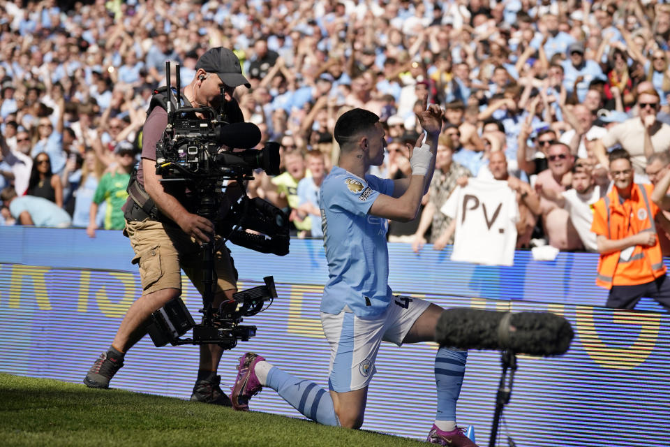 Manchester City's Phil Foden celebrates after scoring his side's opening goal during the English Premier League soccer match between Manchester City and West Ham United at the Etihad Stadium in Manchester, England, Sunday, May 19, 2024. (AP Photo/Dave Thompson)