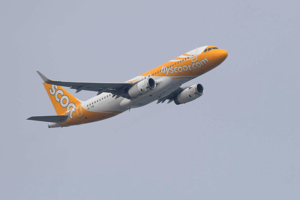 A passenger jet for Singapores low cost airline Scoot takes off from Changi International Airport in Singapore on February 9, 2020. (Photo by ROSLAN RAHMAN / AFP) (Photo by ROSLAN RAHMAN/AFP via Getty Images)