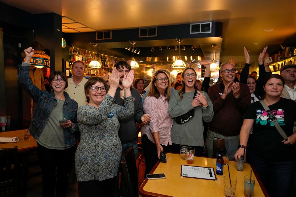 Kentucky governor Andy Beshear supporters cheer while watching election results at Jerry's Jug House in Newport on Tuesday, November 7, 2023 as Beshear takes the lead over Daniel Cameron in the Kentucky governors race.
