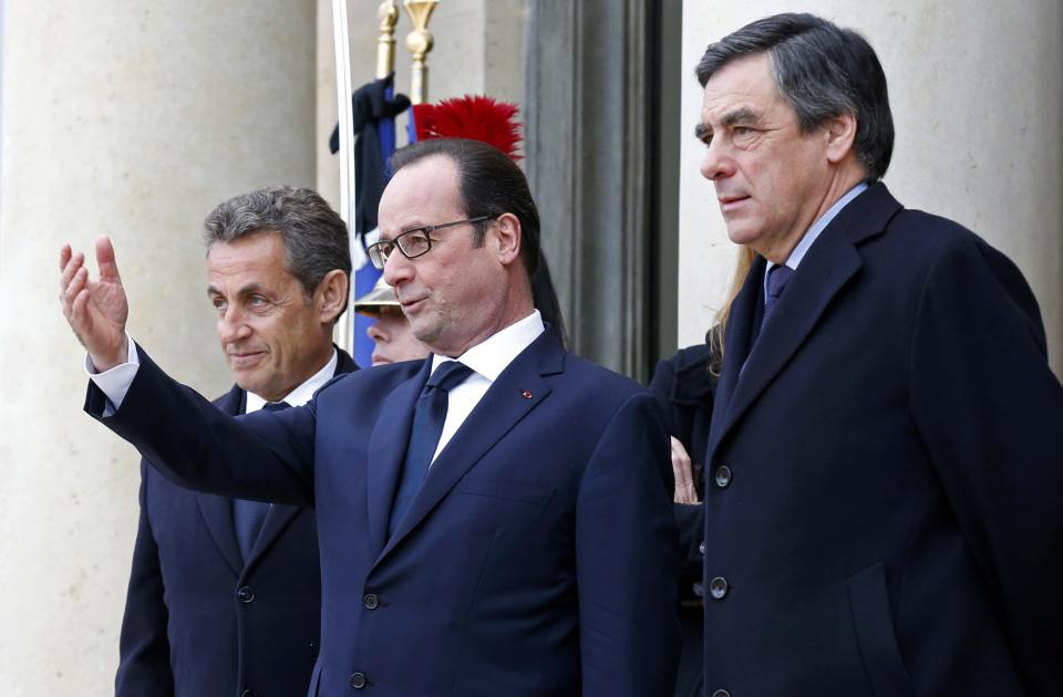 French President Francois Hollande welcomes former French President Nicolas Sarkozy and former prime minister Francois Fillon at the Elysee Palace before attending a solidarity march in the streets of Paris