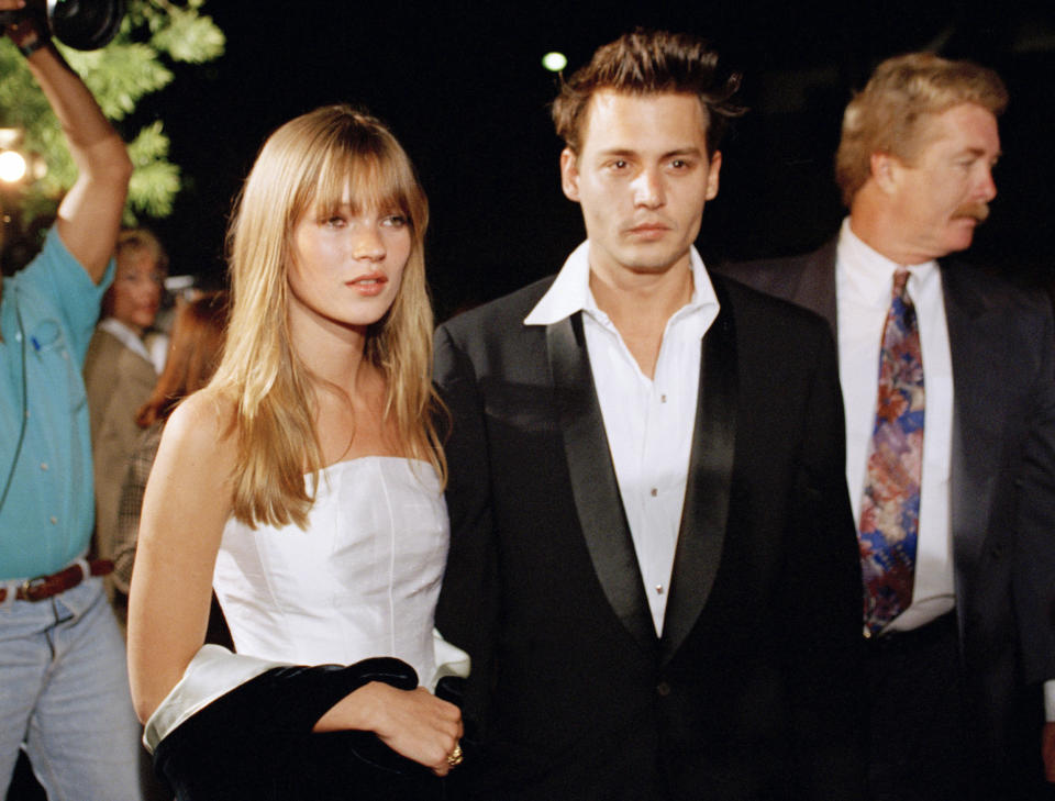 FILE - Model Kate Moss, left, and actor Johnny Depp appear at the premiere of Depp's film 