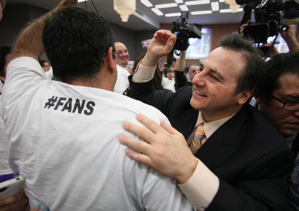 Gavin Maloof, co-owner of the Sacramento Kings, celebrates after the Sacramento City Council approved a plan to help finance a new $391 sports and entertainment arena, in Sacramento, Calif. Tuesday, March 6, 2012. By a 7-2 vote, the City Council approved a non-binding term sheet, signed off by the Kings and the NBA last week, that will keep the team in Sacramento for at least another 30 years. (AP Photo/Rich Pedroncelli)