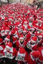 MICHENDORF, GERMANY - DECEMBER 09: Participants dressed as Santa Claus gather shortly before the 4th annual Michendorf Santa Run (Michendorfer Nikolauslauf) on December 9, 2012 in Michendorf, Germany. Over 800 people took part in this year's races that included children's and adults' races. (Photo by Sean Gallup/Getty Images)