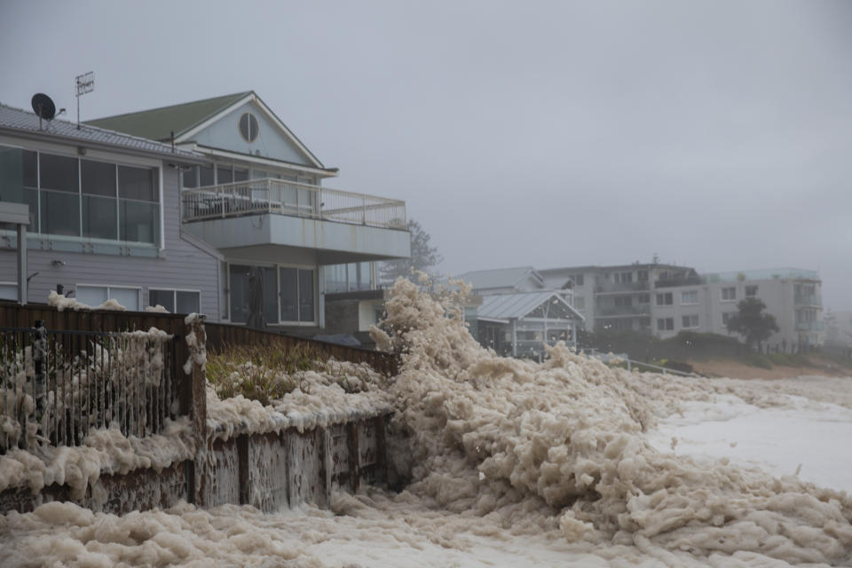 Large waves and sea foam are seen smashing Collaroy on Monday. Source: Getty/Brook Mitchell