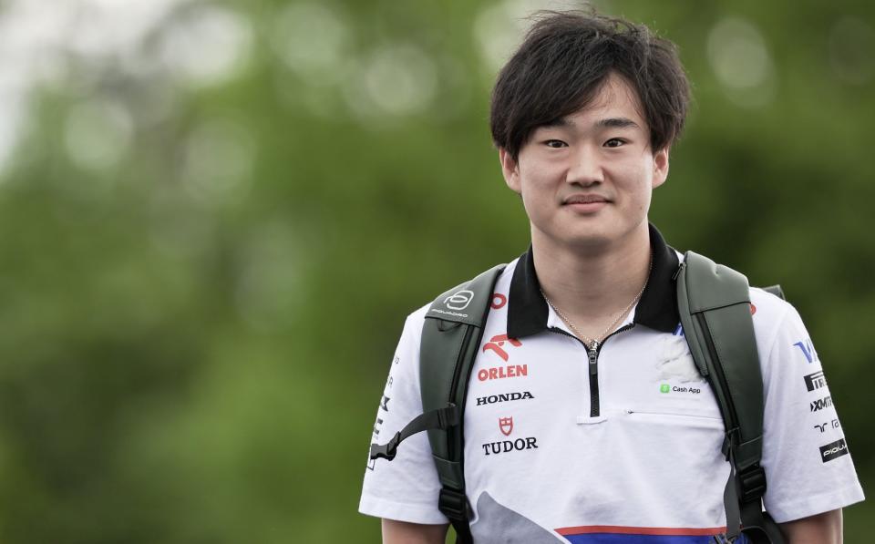 Yuki Tsunoda walking through the paddock