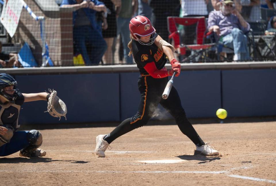 Oakdale’s Presley Barnes connects for an RBI single during the Sac-Joaquin Section D III softball championship game with Capital Christian at Cosumnes River College in Sacramento, Calif., Saturday, May 25, 2024.